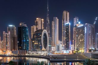 Dubai skyline with Burj Al Arab and international airport amid geopolitical tension in the Gulf region