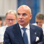 European leaders meeting discussing Green Deal revisions, with EU flags and energy industry symbols highlighting economic and policy tensions