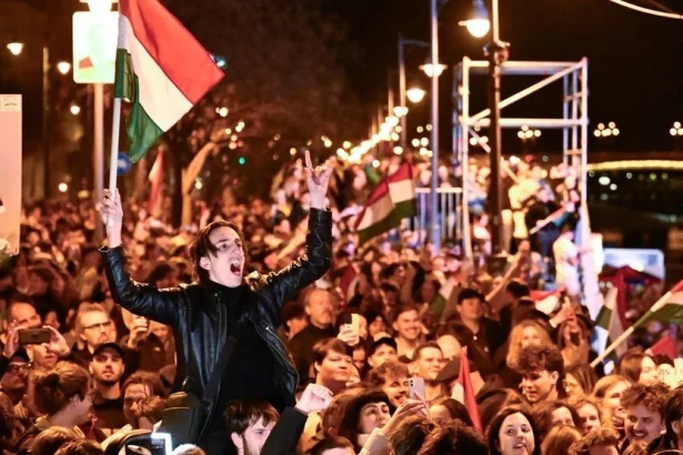 Viktor Orbán and Péter Magyar against the backdrop of the Hungarian Parliament in Budapest, illustrating the political and strategic costs of Hungary’s post-Orbán transition.