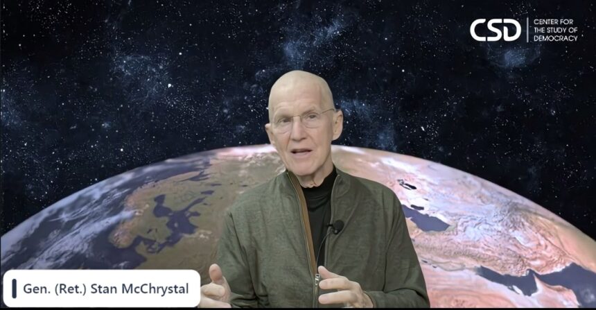 Retired General Stanley McChrystal speaking during a Center for the Study of Democracy event, with an image of Earth in the background.