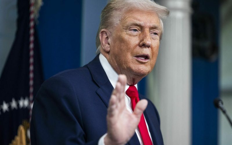 US President Trump speaks on to reporters ahead of trip to Davos